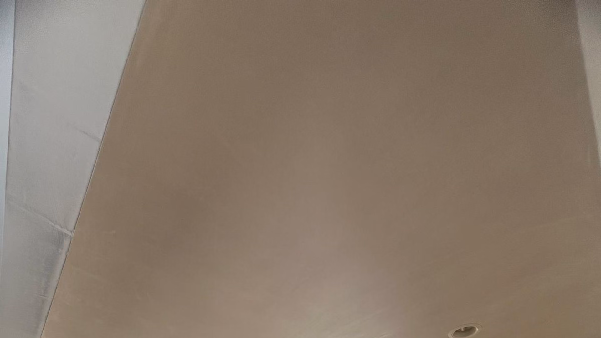 L&A Plastering crew skim-coating a ceiling on a job site in Greater Boston