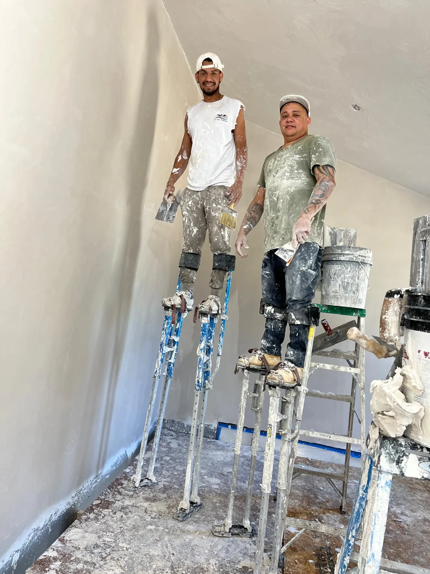 L&A crew skim-coating walls